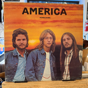 AMERICA <br> HOMECOMING
