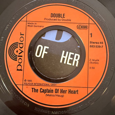 DOUBLE <br> THE CAPTAIN OF HER HEART